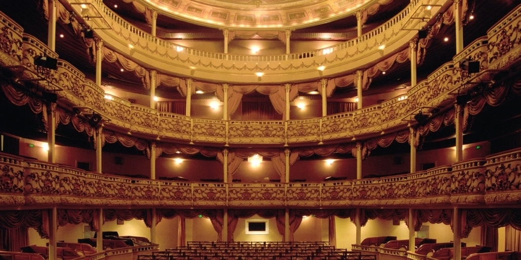 theater with empty seats and balconies